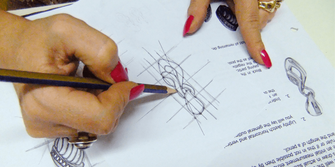 instructor grading jewellery design assignment