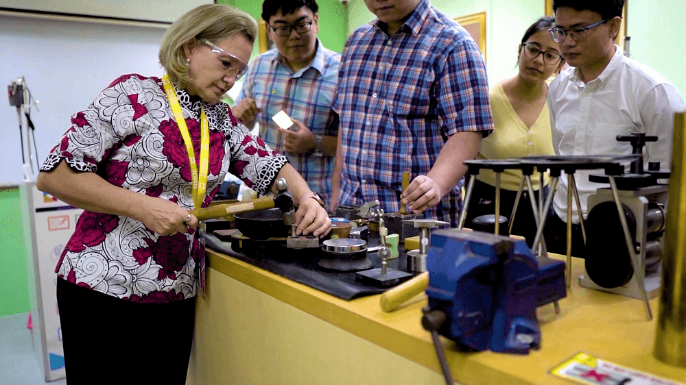 Instructor Tanja demonstrate metalsmithing techniques