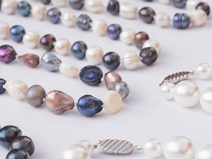 Picture of strands of pearls of different colours